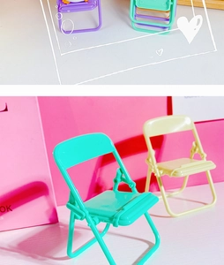 Three colorful mini folding chair phone stands in purple, mint green and beige plastic