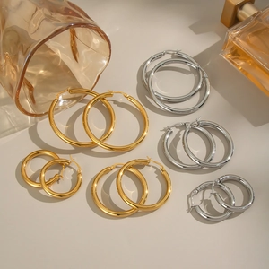 Minimalist stainless steel hoop earring set with 4 pairs of gold and silver round hoops