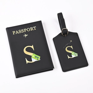 Black PU leather passport holder and luggage tag set with golden letter S and airplane motif