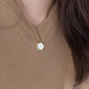 Minimalist 925 sterling silver shell pendant necklace with a gold geometric frame