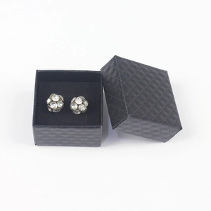 Sparkling crystal ball stud earrings displayed in a black quilted jewelry gift box