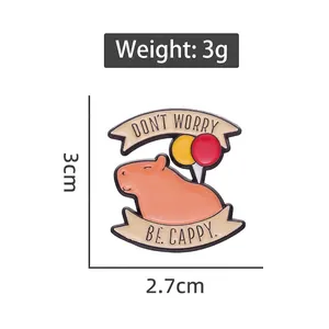 Cartoon capybara enamel pin with balloons and Don't Worry Be Cappy text, 3cm size