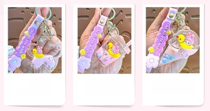 Detail view of Sakura, Milk Tea Cup, and Ice Cream shaped quicksand keychains