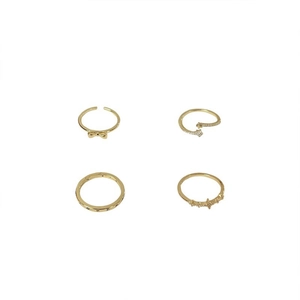 4-piece gold minimalist ring set with bow, star, and crescent moon details