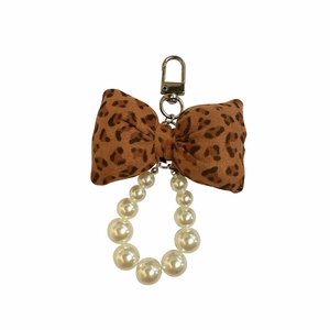 Leopard print bow keychain with white faux pearl ring and gold metal spring clasp