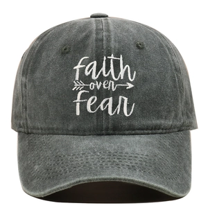 Detail of Christian Faith embroidery on washed cotton baseball cap with faith over fear text