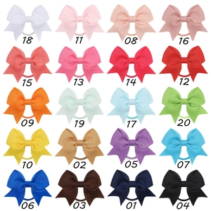 20 vibrant colors of ribbed grosgrain ribbon bow hair ties in an organized grid display