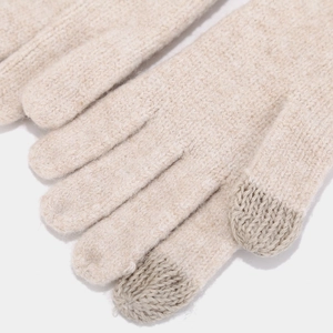 Detail view of knit gloves showing touchscreen fingertips in cream white and grey yarn