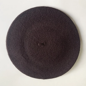 Top view of a black wool beret with center stem detail on a clean white background