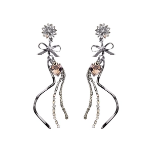Elegant floral tassel earrings with heart crystal and sparkling bowknot on white background