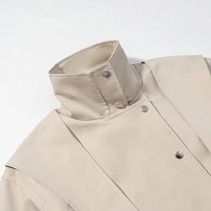 Chic beige high-neck motorcycle jacket featuring premium metal buttons and textured fabric