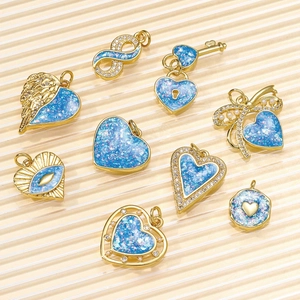 Golden opal charms in heart, butterfly, and evil eye shapes for DIY jewelry sets