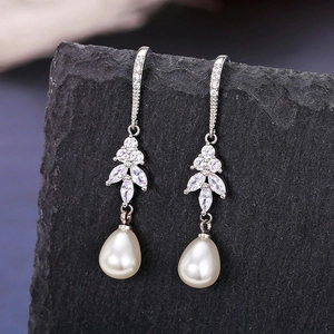 Elegant long pearl drop earrings with leaf crystal accents and silver hooks for women