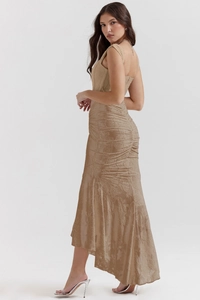 Detailed back view of a slim champagne lace dress with fishtail hem and floral embroidery
