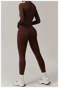 Back view of a brown long-sleeved athletic jumpsuit with slimming fit and high waist line