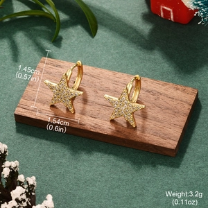 Gold star earrings with sparkling crystals and size dimensions for festive styling