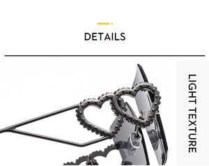 Detail showing interlocking heart design on the metallic temple of rimless sunglasses