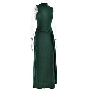 Detail view of dark green sleeveless fishtail dress with shiny fabric and waist tie