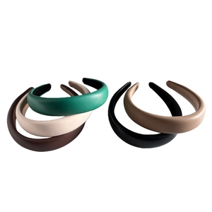 Detailed view of PU leather headbands in black, beige, dark green, and khaki colors