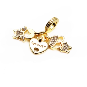 Close-up of gold heart charm engraved with forever and micro-paved zircon figures
