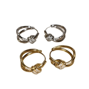 Minimalist knot hoop earrings with gold and silver plating and cubic zirconia accents
