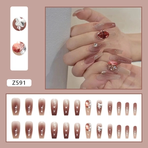 Pink gradient press-on nails with luxury crystals and silver butterfly in long coffin shape