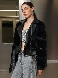 Chic black faux fur leather jacket with plush trim shown in urban industrial setting