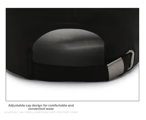 Detail of black cotton baseball cap showing adjustable metal buckle and twill fabric texture