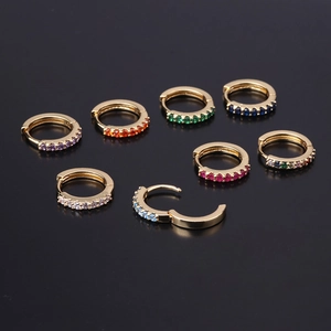 Colorful huggie hoop earrings with multi-color cubic zirconia in polished gold finish