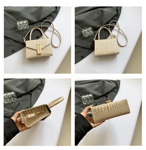 Detail view of champagne crocodile pattern handbag showing metal clasp and inner lining