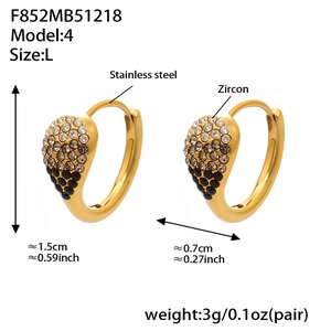 Detailed view of 18k gold plated stainless steel teardrop earrings with black and white zircon