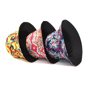 Three-pack tie-dye bucket hats with reversible black lining in assorted vibrant swirl patterns