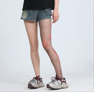 Detailed tattoo-style peony floral print on sheer tights with vintage streetwear aesthetic