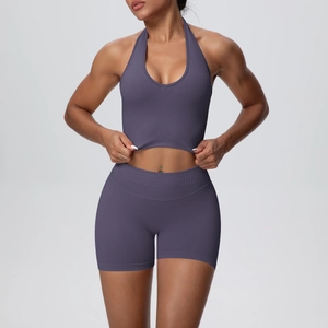 Detail of seamless knitted sports set showing halter neck bra and high waist shorts texture