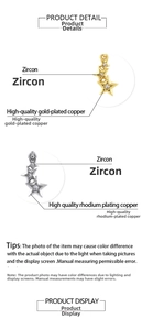 Detail of 18K gold and rhodium plated copper pendants with zircon micro-paving