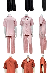 Detail of silk satin pajama sets with short sleeves and pants in black pink and rust red