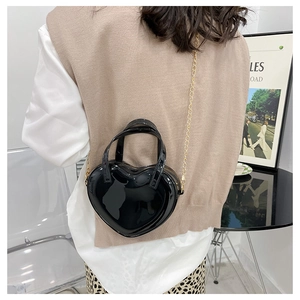 Rear view of model wearing black heart-shaped mini jelly bag for styling visualization