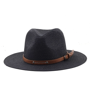Detail of black woven straw boater hat with brown faux leather studded band and metal buckle