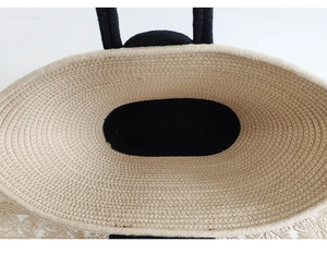 Top down view of beige cotton woven beach tote showing internal black lining and texture