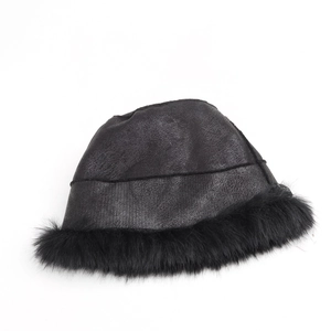Detail view of winter black faux leather bucket hat with plush faux fur trim and lining