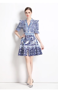 Detailed view of the V-neck and porcelain print on the retro flared sleeve dress