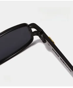 Detailed close-up of sturdy metal hinge on trendy black frame sunglasses for long-lasting use