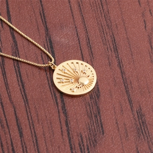 Gold evil eye pendant necklace with celestial star and planet details on box chain