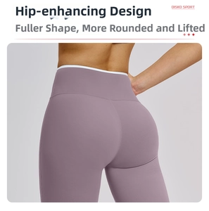 Detail of high waist yoga pants showing peach lift seam and contrasting white trim edge