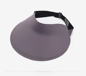 Side view of foldable wide-brim sun hat with elastic adjustable strap and logo detail