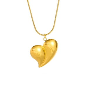 Detailed view of an 18K gold-plated large heart pendant on a smooth snake chain necklace