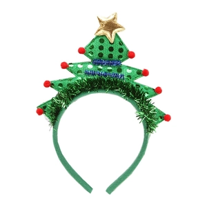 Green sequined Christmas tree headband with red pom-poms and gold star on white background