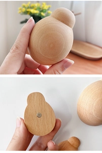 Macro detail of wooden bottle opener with integrated magnet for creative fridge storage