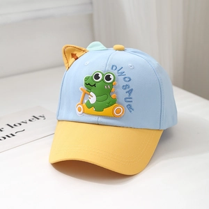 Detail of blue and yellow kids dinosaur baseball cap with cute orange ears and soft patch