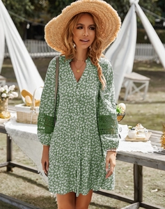 Detailed lace stitching on long-sleeved green floral dress for casual summer vacation
